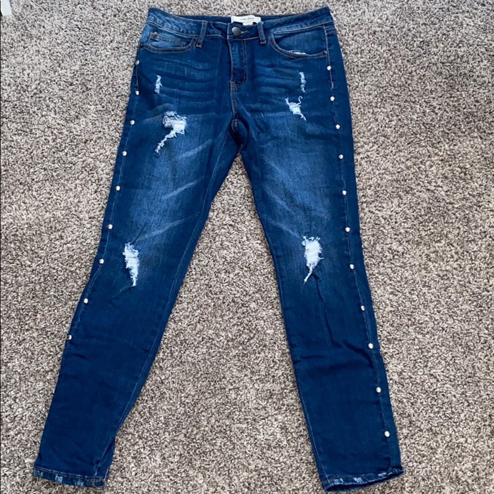 Distressed blue jeans